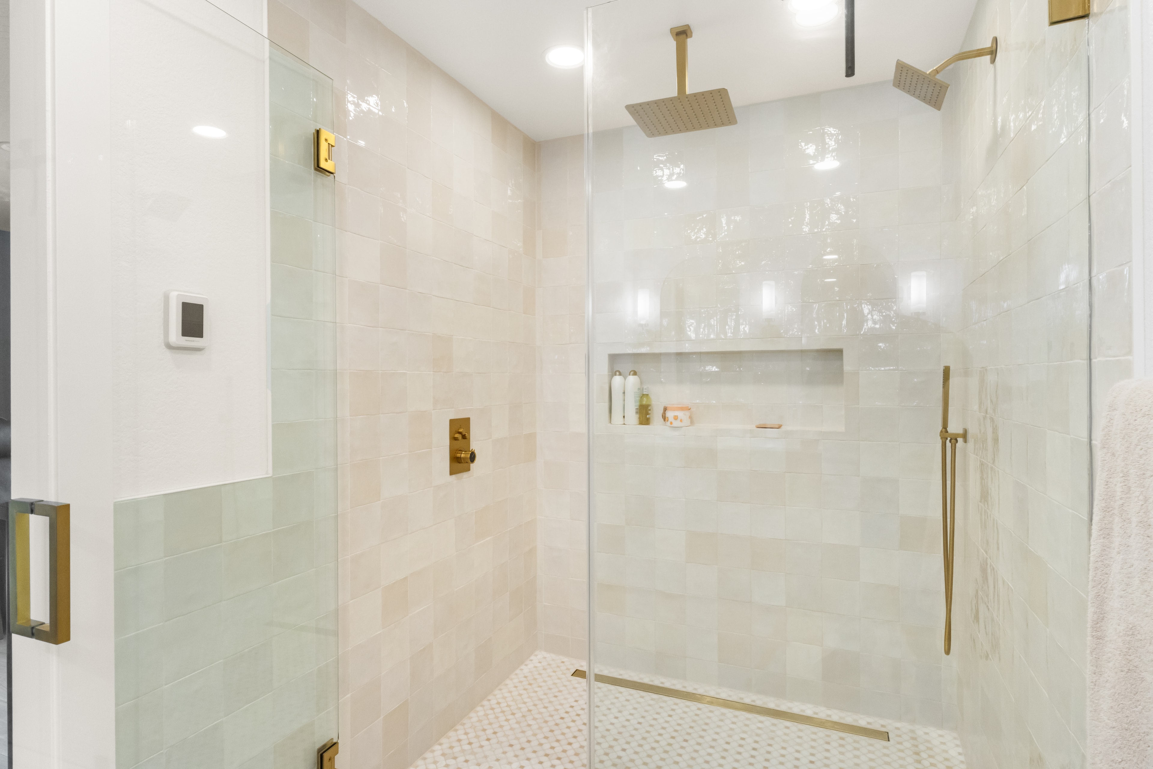 Eagle bathroom remodel — glass shower enclosure with zellige tile and brass fixtures