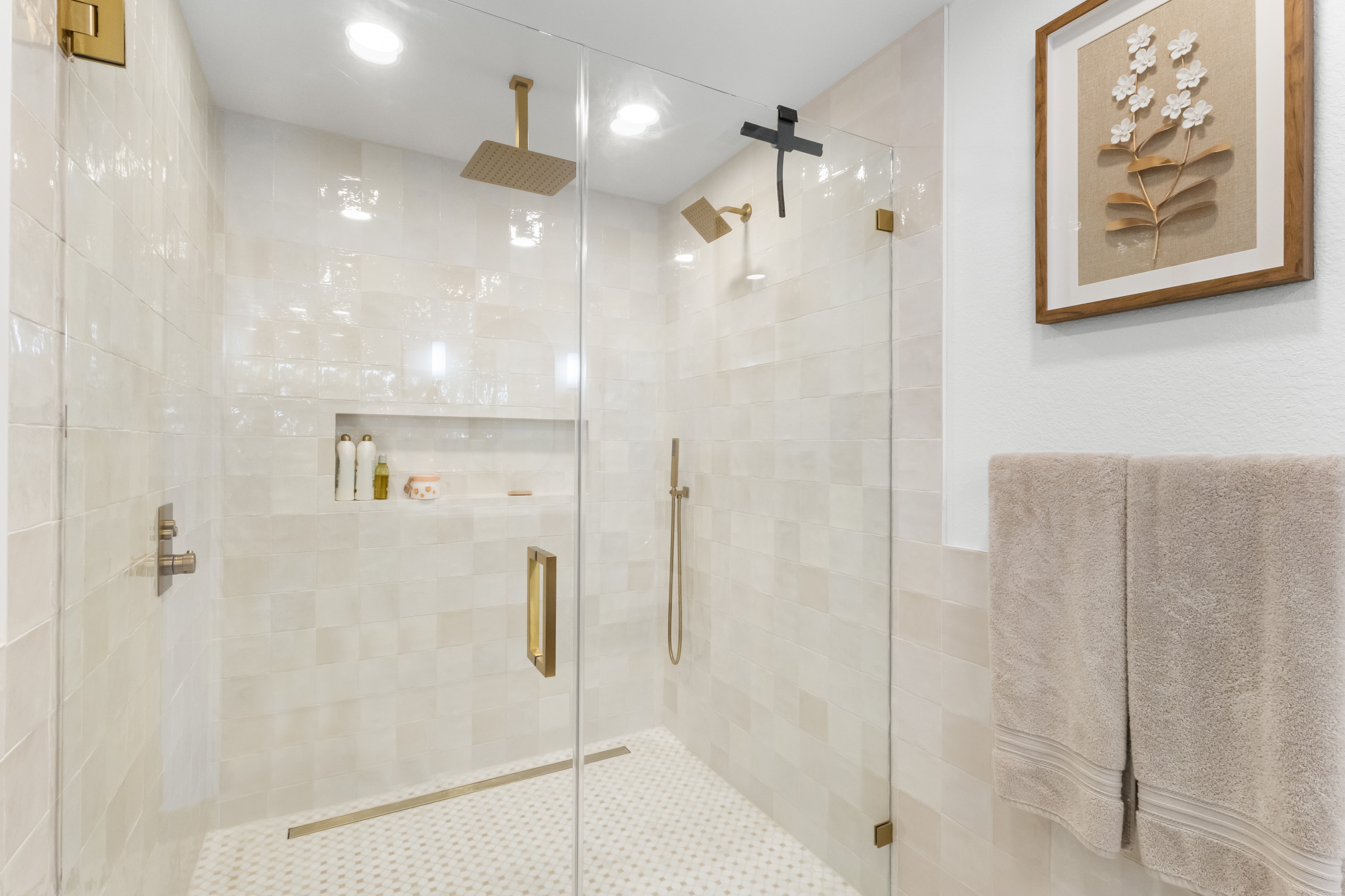 Eagle bathroom remodel — frameless glass shower with rain head and mosaic tile floor