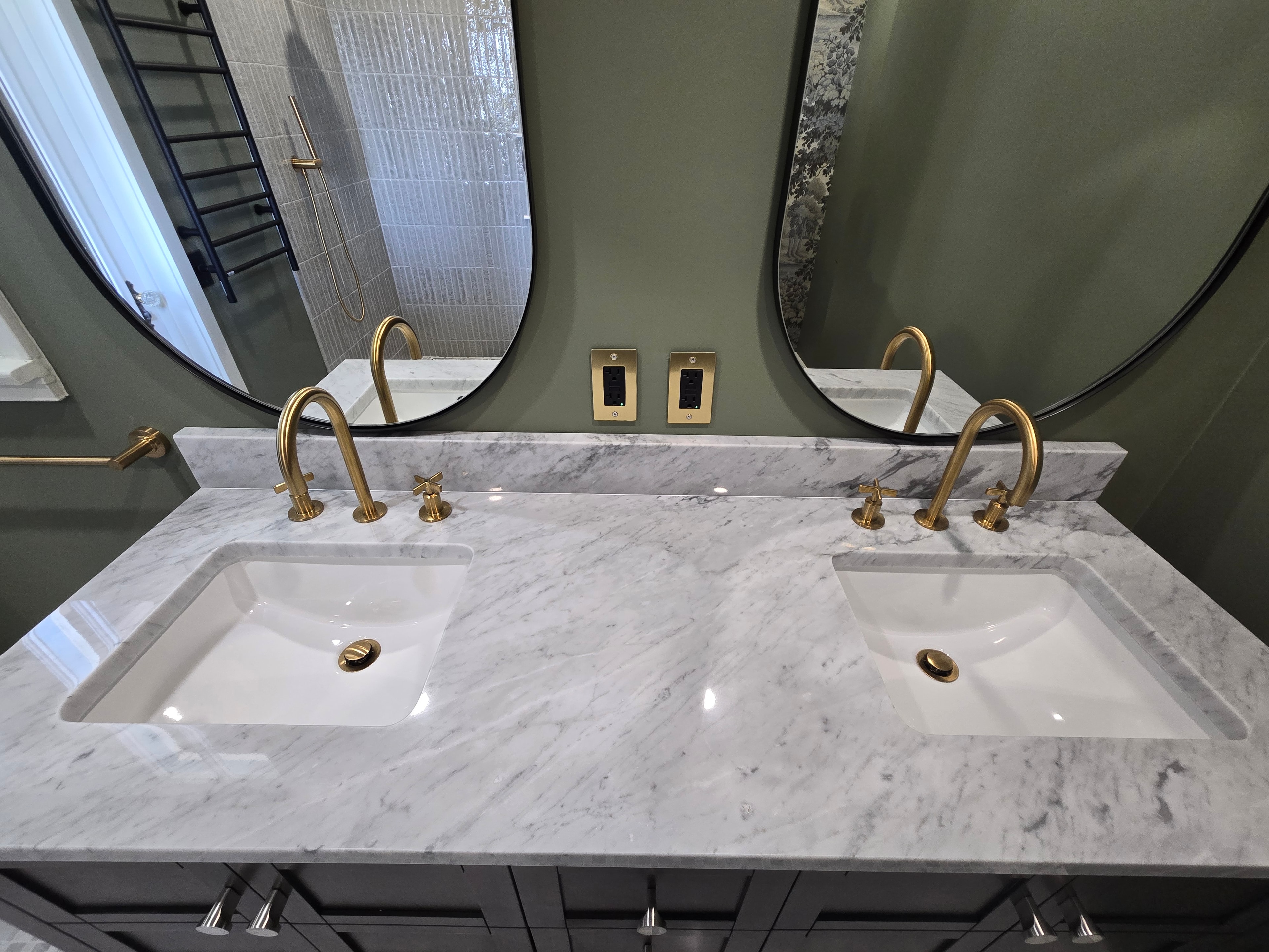 Bathroom remodel — dual marble vanity with brass fixtures