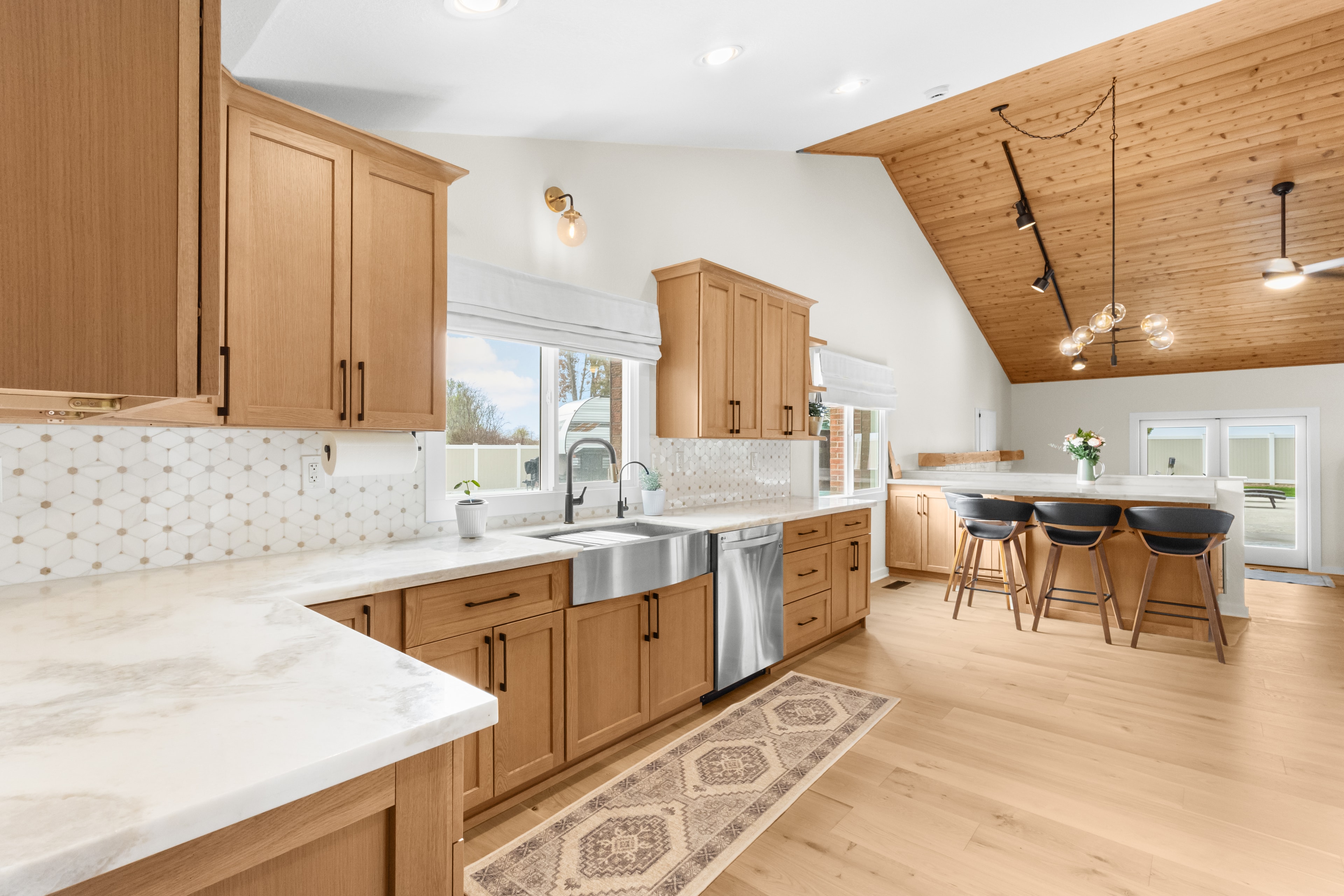 Kitchen remodel — open concept with vaulted wood ceiling and farmhouse sink