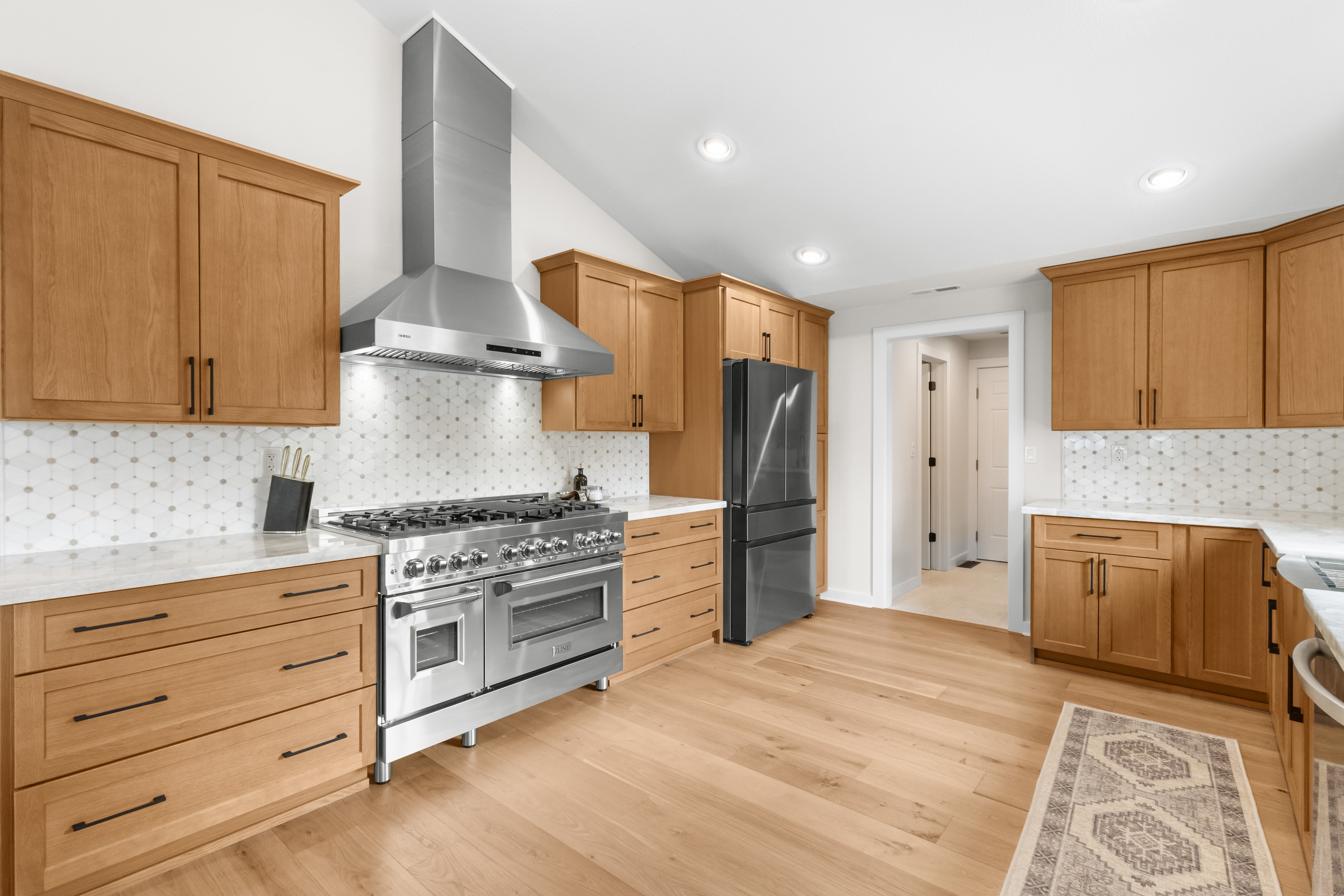 Kitchen remodel — wide view with professional range and custom cabinetry